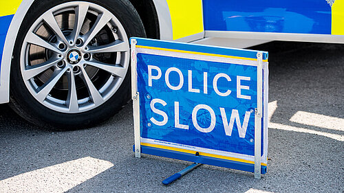 Police slow sign